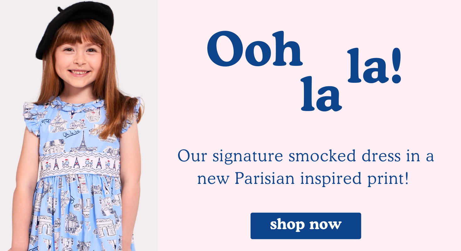 Shop our signature smocked dress in a new Parisian themed print!